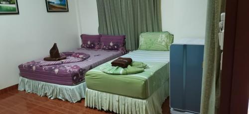 Postel nebo postele na pokoji v ubytování Harmony House-SHA Plus