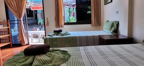 Postel nebo postele na pokoji v ubytování Harmony House-SHA Plus