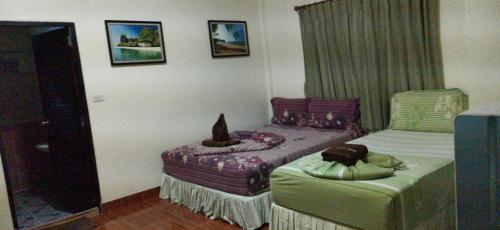 Postel nebo postele na pokoji v ubytování Harmony House-SHA Plus
