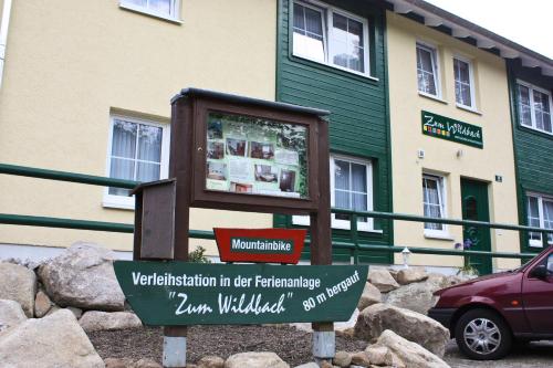 a sign in front of a building at Ferienanlage Zum Wildbach Schierke in Schierke