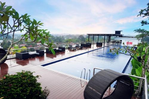 a large swimming pool on top of a building at INNSiDE by Meliá Yogyakarta in Yogyakarta