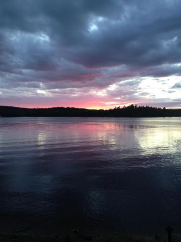a view of a large body of water at sunset at Två Skyttlar in Örby
