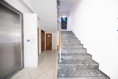 a stairway in a building with a stair case at Rotonda Hotel in Thessaloniki