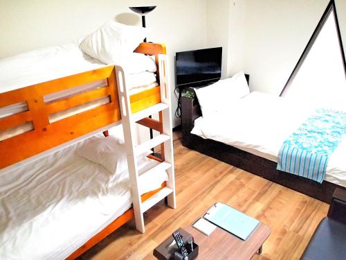 Postel nebo postele na pokoji v ubytování COCOSTAY Matoba#902 ココステイ マトバ#902 広島駅徒歩10分 10 min walk from Hirosima Station