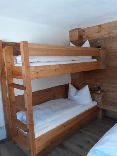 a bedroom with two bunk beds in a room at Reithgut in Sankt Martin am Tennengebirge