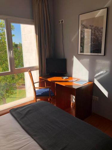 Un ou plusieurs lits dans un hébergement de l'établissement Hotel Alda Ciudad de Soria