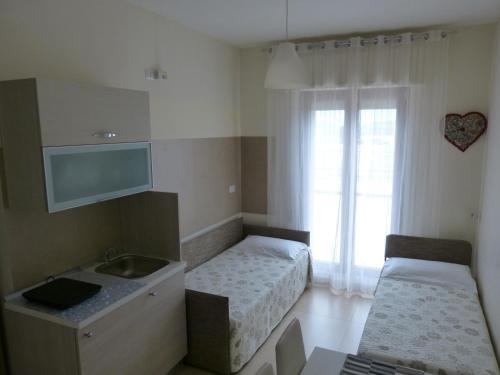 A bed or beds in a room at Lo Scrigno
