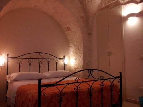 Un pat sau paturi într-o cameră la Trullo Amico