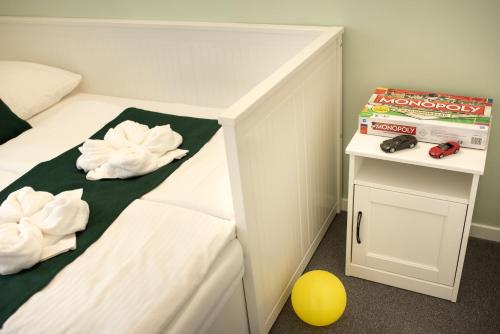 a childs bedroom with a bunk bed and a yellow ball at Topáz Apartmanházak in Balatongyörök