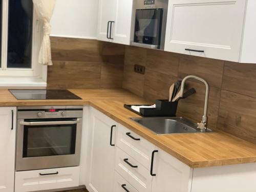 Kuchyň nebo kuchyňský kout v ubytování Apartmány TIME