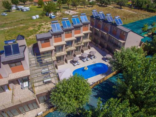 an aerial view of a hotel with a swimming pool at Hotel Palladium Sithonia in Kalamitsi