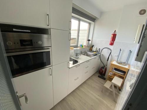 
A kitchen or kitchenette at Roof Studio with Large Sun Terrace in Middelkerke

