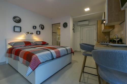 Postel nebo postele na pokoji v ubytování DOMINO studio