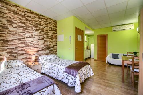 Кровать или кровати в номере Apartamentos Barajas