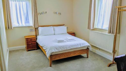 Postel nebo postele na pokoji v ubytování Ivybridge Guesthouse