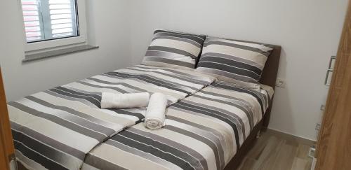 Cama o camas de una habitación en White Apartment