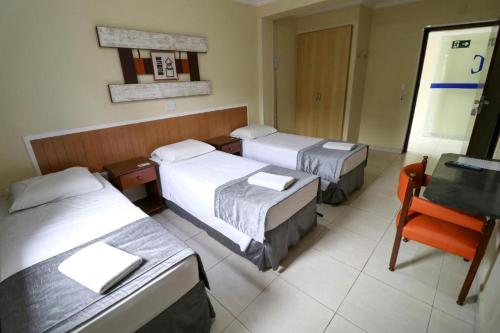 Katil atau katil-katil dalam bilik di Charme Hotel Guarujá Frente Mar