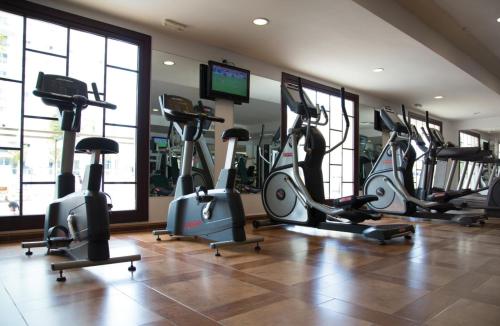 a gym with a bunch of exercise bikes in a room at Riu Palace Aruba - All Inclusive in Palm-Eagle Beach