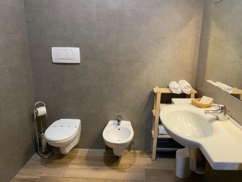 a bathroom with a toilet and a sink at Residence Verdeblu in Arco