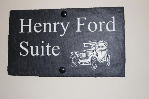 a sign with a drawing of a car on it at Kilcatten Lodge in Kilbrittain