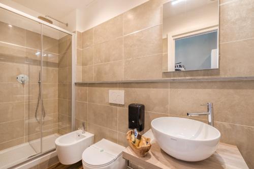 a bathroom with a sink and a toilet and a shower at 5 terre dei poeti in La Spezia