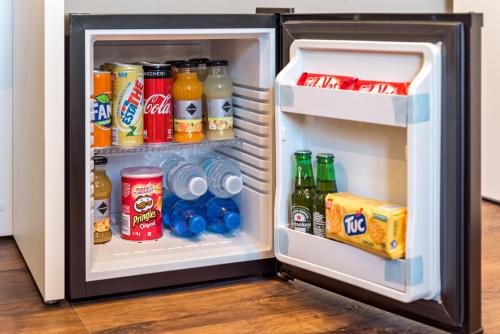 an open refrigerator filled with drinks and soda at 5 terre dei poeti in La Spezia