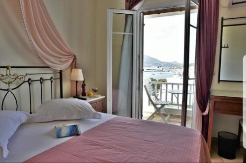 Ліжко або ліжка в номері Ostria Hotel 