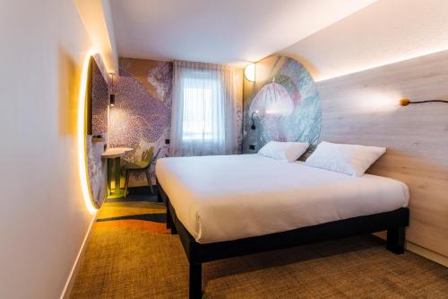 Cama o camas de una habitación en ibis Styles Antibes