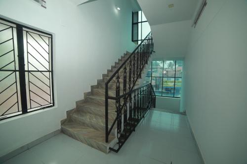 a staircase in a building with a window at MEGHNA RESIDENCY in Trivandrum