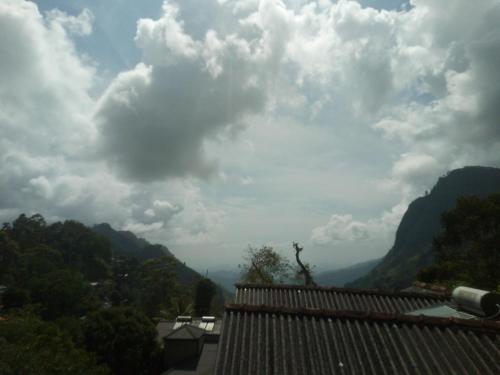 a view of the mountains from a roof of a house at Green View Ella in Ella