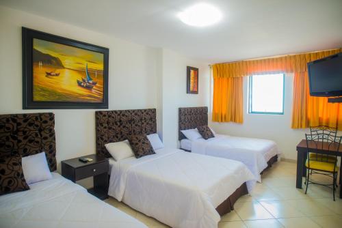 מיטה או מיטות בחדר ב-Hotel Presidente Beach Salinas