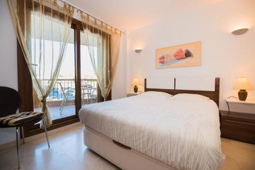 Een bed of bedden in een kamer bij Apartament PARAISO DEL SOL