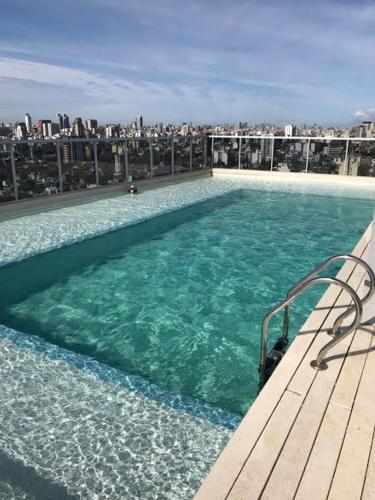 a large swimming pool on top of a building at Mirador 703 Palermo in Buenos Aires