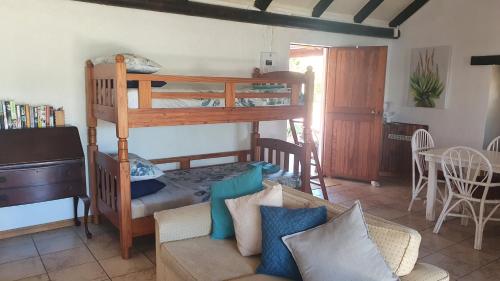 a living room with bunk beds and a couch at Faodail Guest House in Velddrif