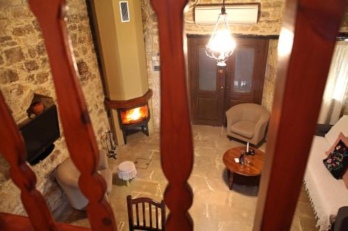 an overhead view of a living room with a fireplace at Agrovino Lofou in Lofou