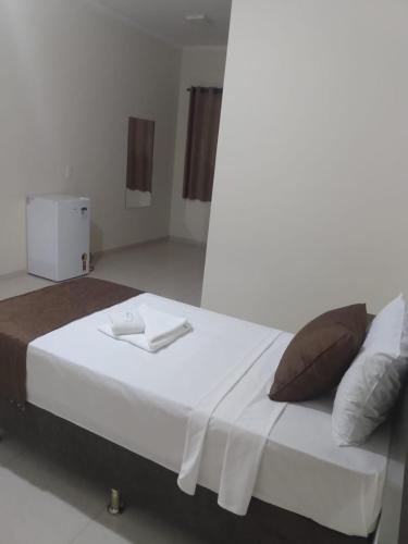 Postel nebo postele na pokoji v ubytování Hotel Martins