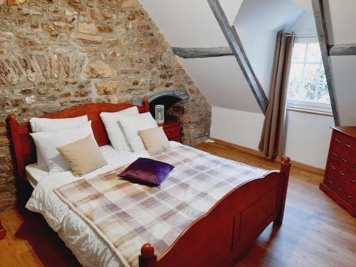Llit o llits en una habitació de gîtes de la petite suisse
