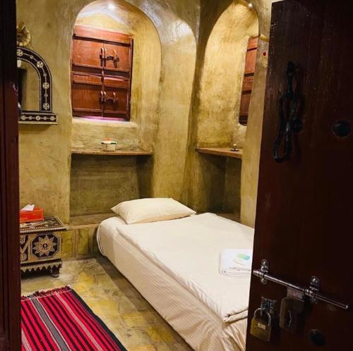 Postelja oz. postelje v sobi nastanitve Bait Al Aqr
