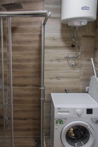 a washer and dryer in a tiny house at APARTMAN TEA in Belgrade