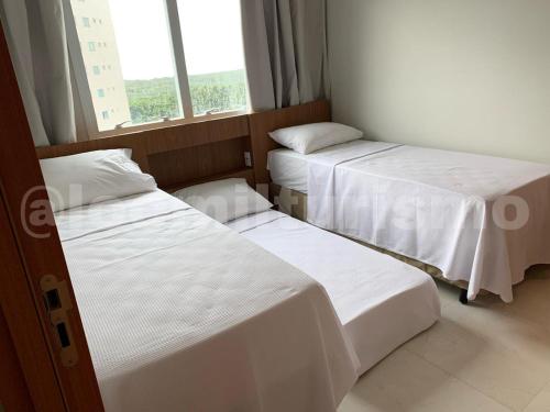 Postel nebo postele na pokoji v ubytování Apartamento em Resort - Exclusive