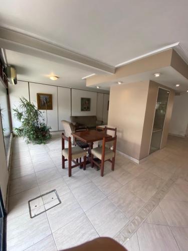a dining room with a table and chairs in it at Hotel Miami in San Miguel de Tucumán