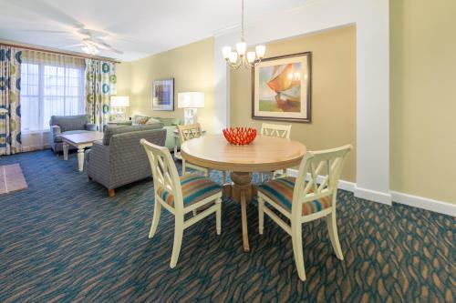 a dining room and living room with a table and chairs at Holiday Inn Club Vacations South Beach Resort in Myrtle Beach