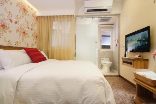 Ένα ή περισσότερα κρεβάτια σε δωμάτιο στο Golden Hotel
