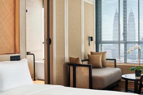 Ein Bett oder Betten in einem Zimmer der Unterkunft The RuMa Hotel and Residences