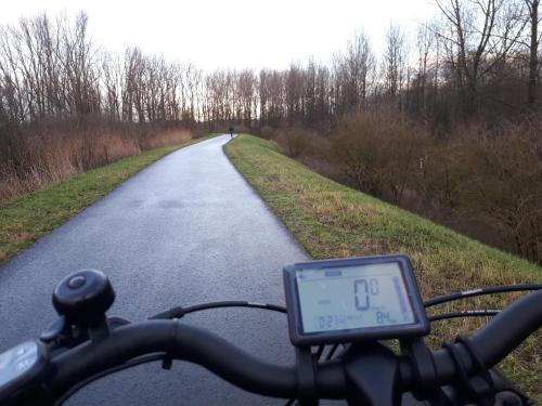 a person riding a bike on a road at Vertentenhuis in Hamme