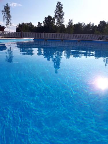 a large swimming pool with blue water at Camping Tornio in Tornio
