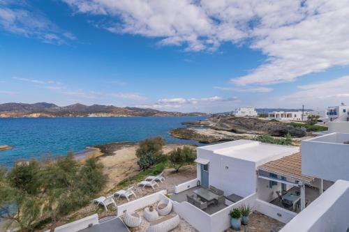a view of the ocean from the balcony of a house at Venia's Guesthouse in Pollonia