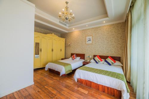 Boyi Apartment - Shanghai National Convention and Exhibition Center Branchにあるベッド
