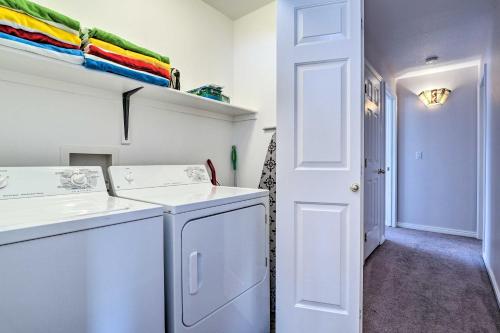 a white laundry room with a washer and dryer at Condo with Resort Amenities, by Downtown St George! in St. George