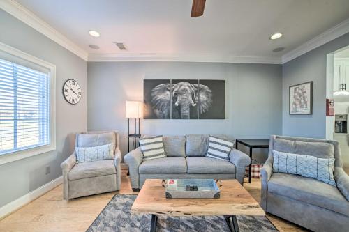 a living room with a couch and two chairs and a table at Modern Retreat about half Mi to Bryant-Denny Stadium in Tuscaloosa